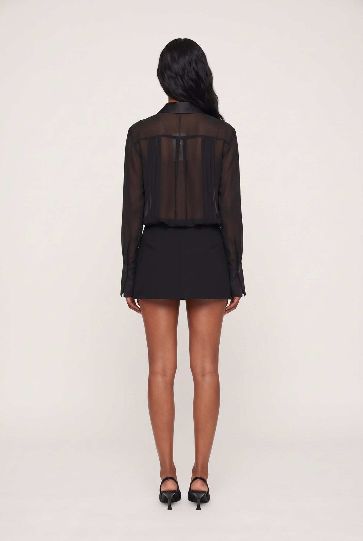 model wearing Rixanne Dress posing Back View