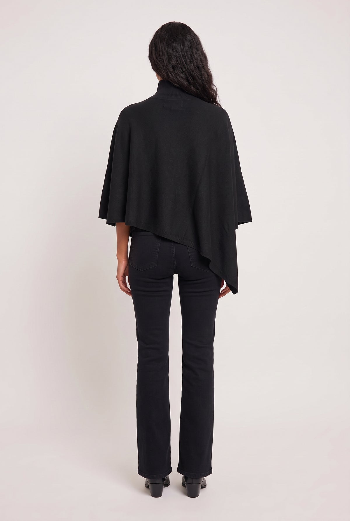 model wearing Tiwa Cape posing Back View