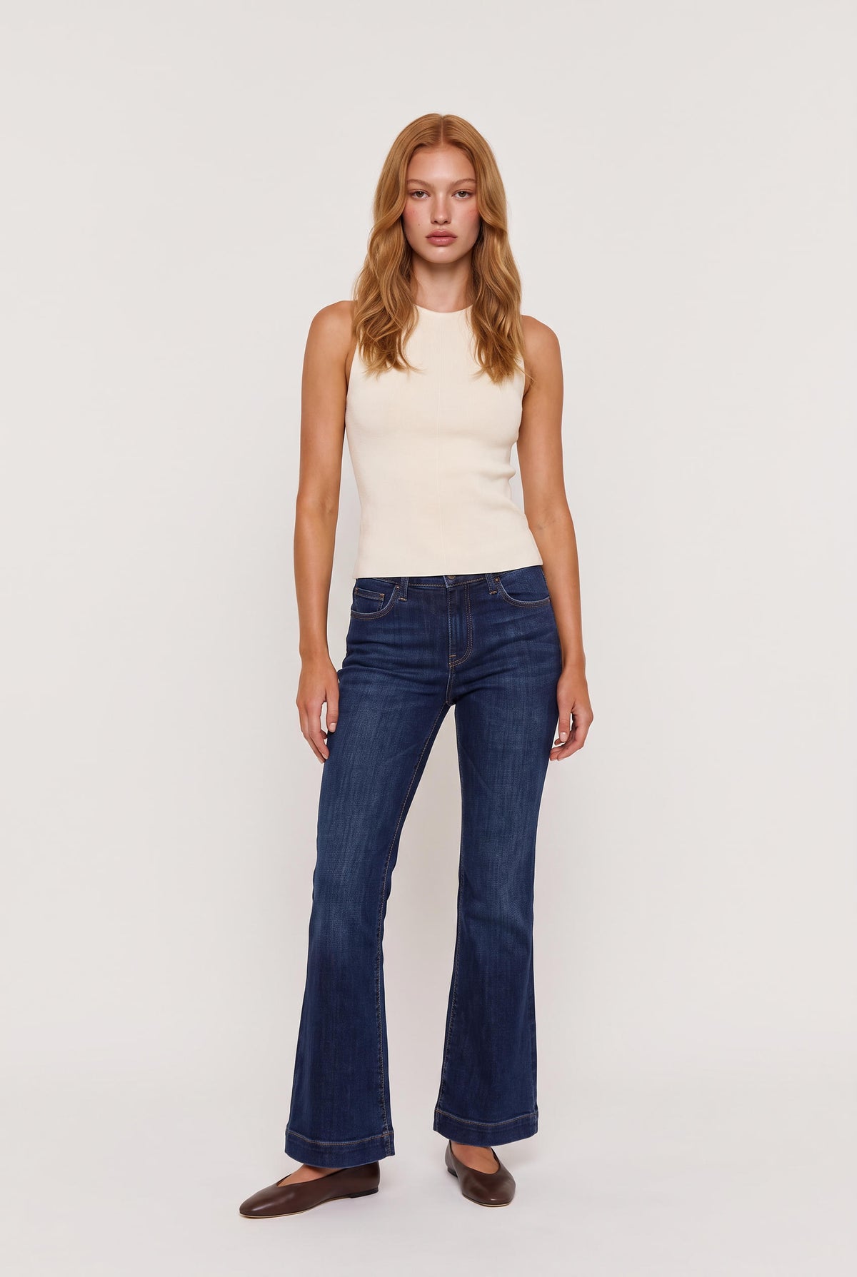 model wearing The Lucerne Top posing Front View
