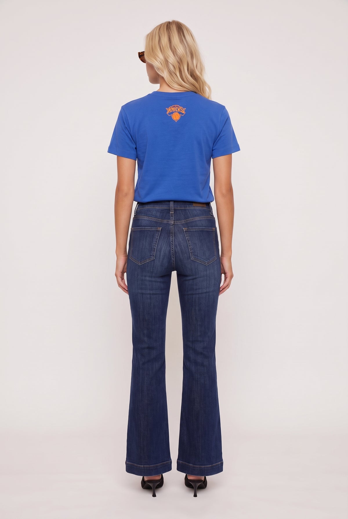 model wearing Knicks Championship Baby Tee posing Back View