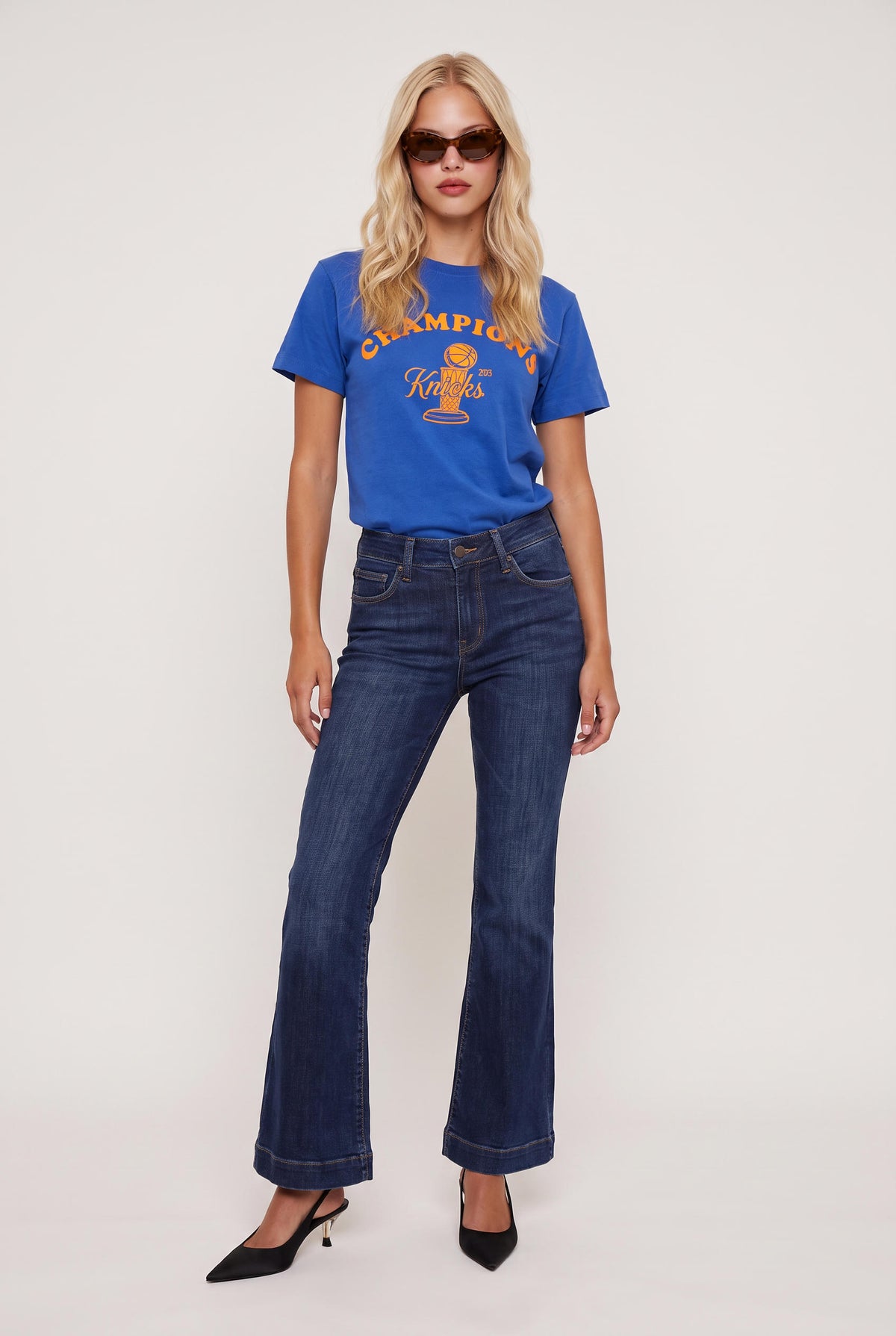 model wearing Knicks Championship Baby Tee posing Front View