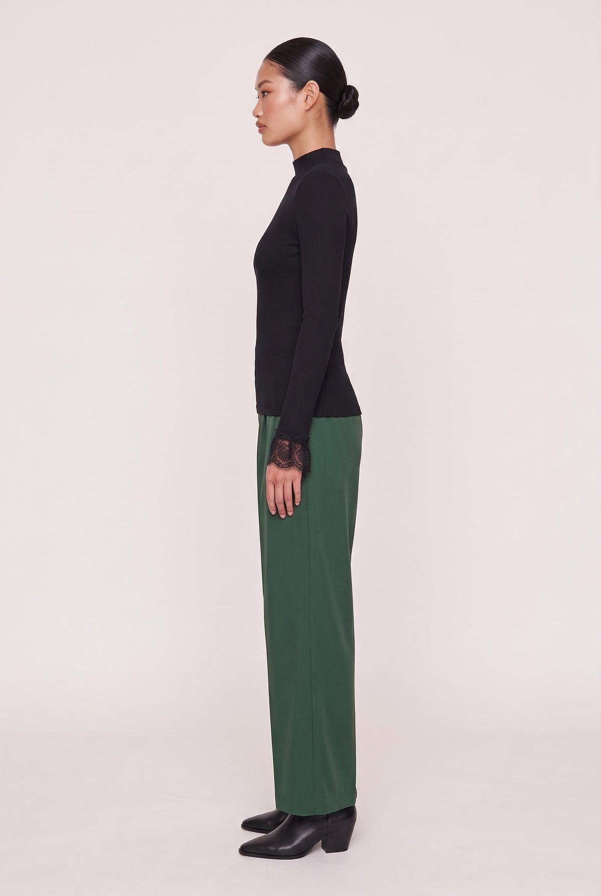 model wearing Cordelia L/s Turtleneck posing Side View