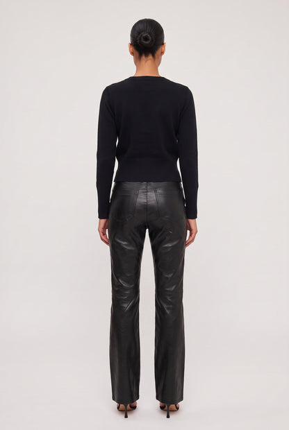 
model wearing Vegan Leather Flare Pant posing Back View