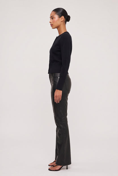 
model wearing Vegan Leather Flare Pant posing Side View
