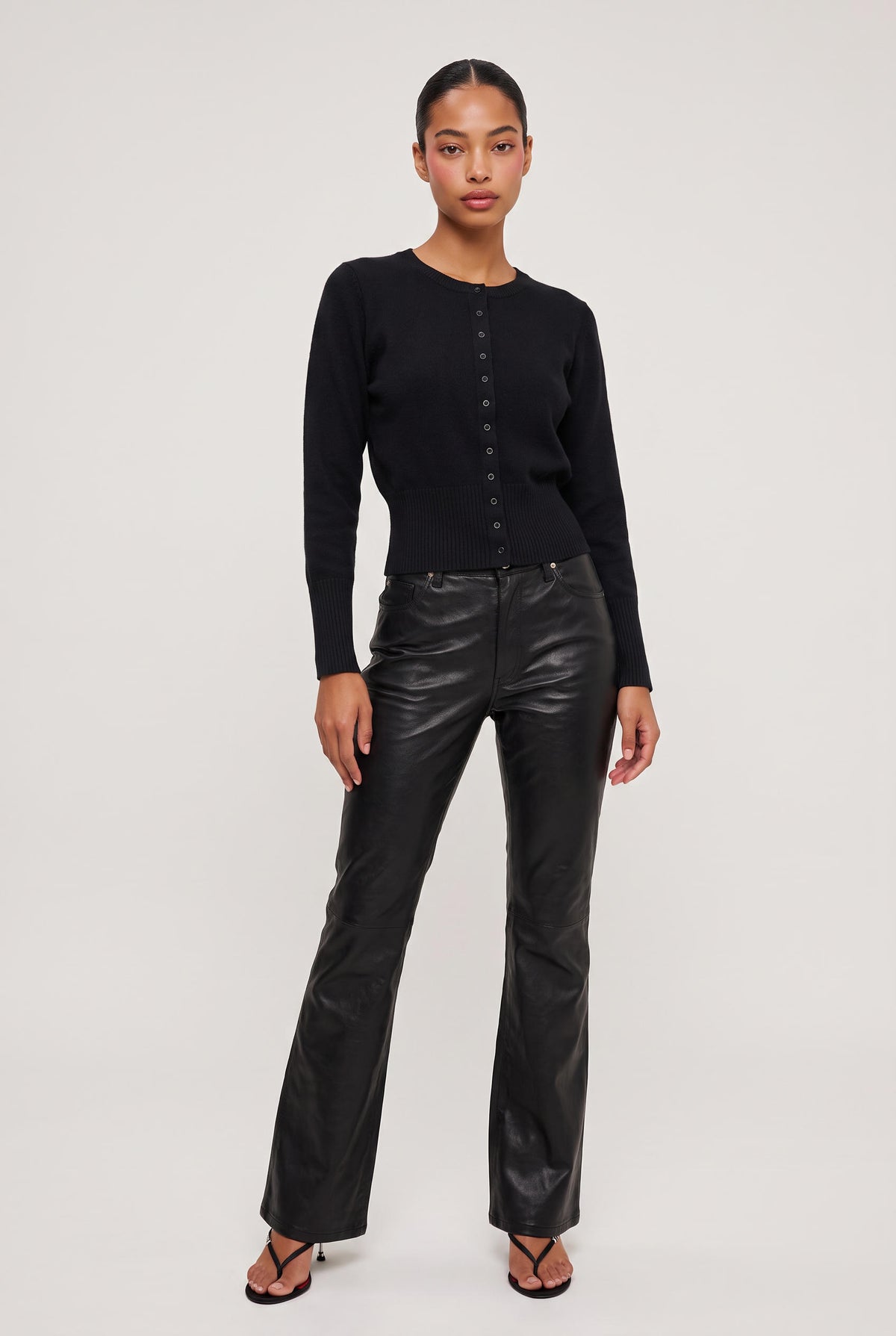 [BLACK] model wearing Vegan Leather Flare Pant posing Front View