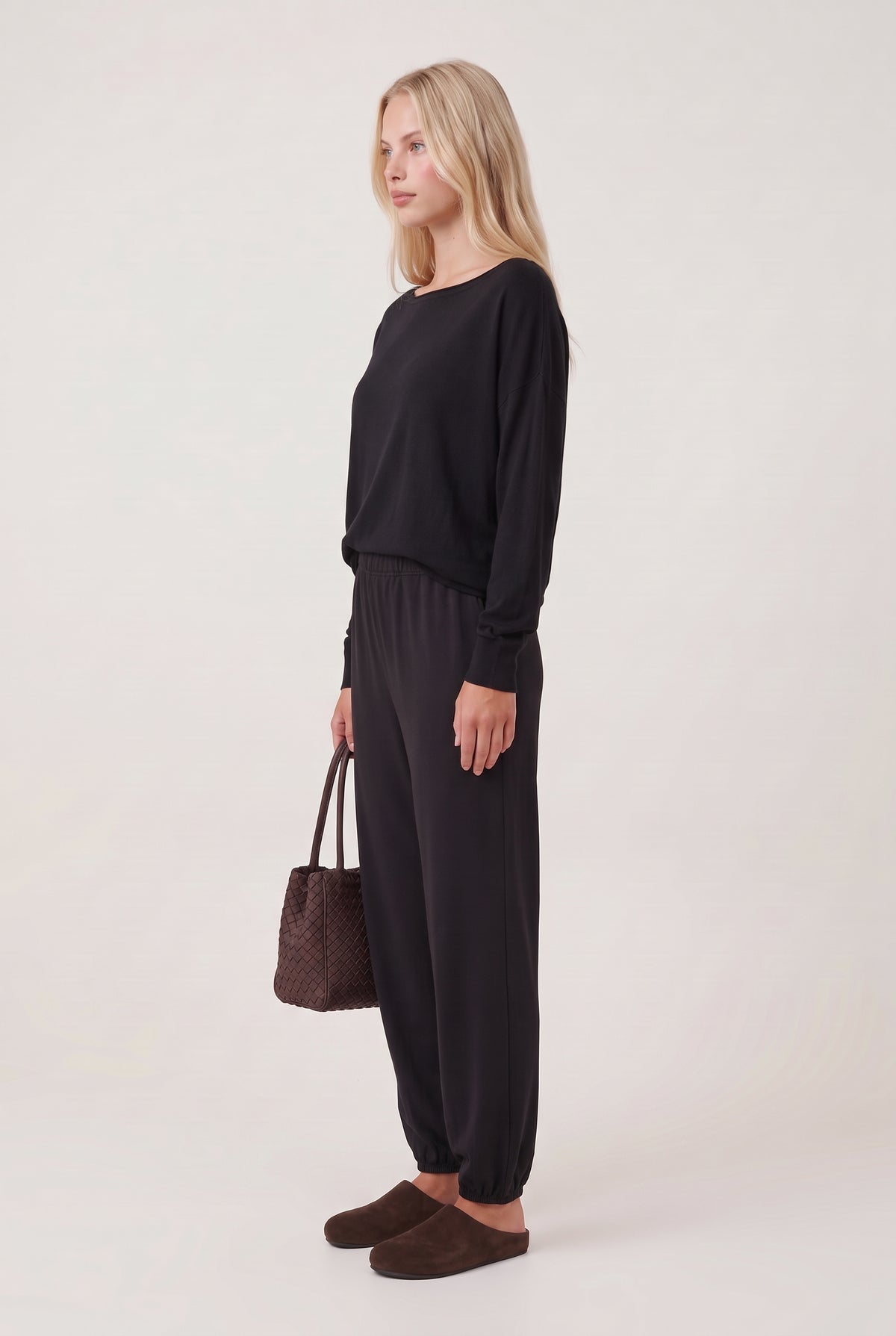 [BLACK] model wearing Drop Slv Boat Neck Top posing Side View