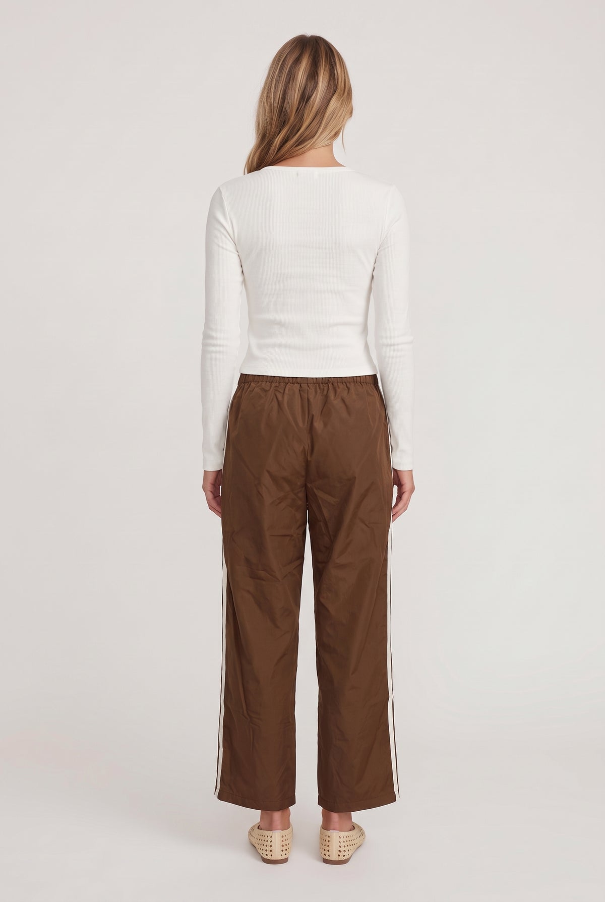 
model wearing DOWNTOWN TRACK PANT posing Back View