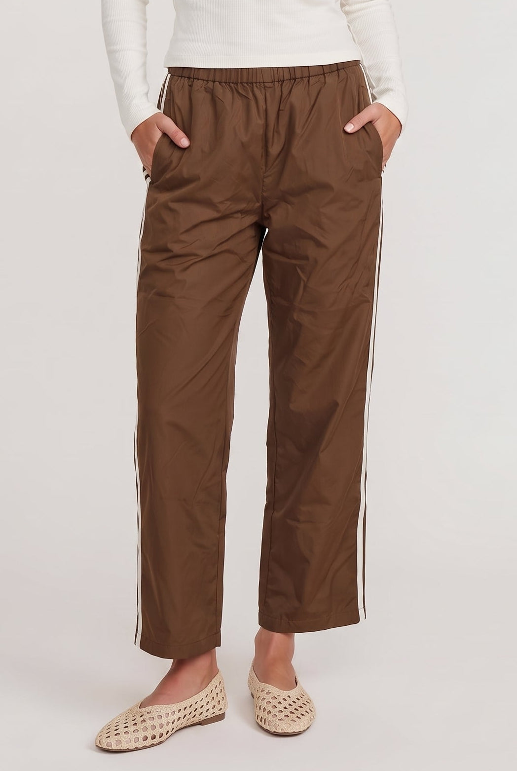 [BROWN] model wearing DOWNTOWN TRACK PANT posing Front View