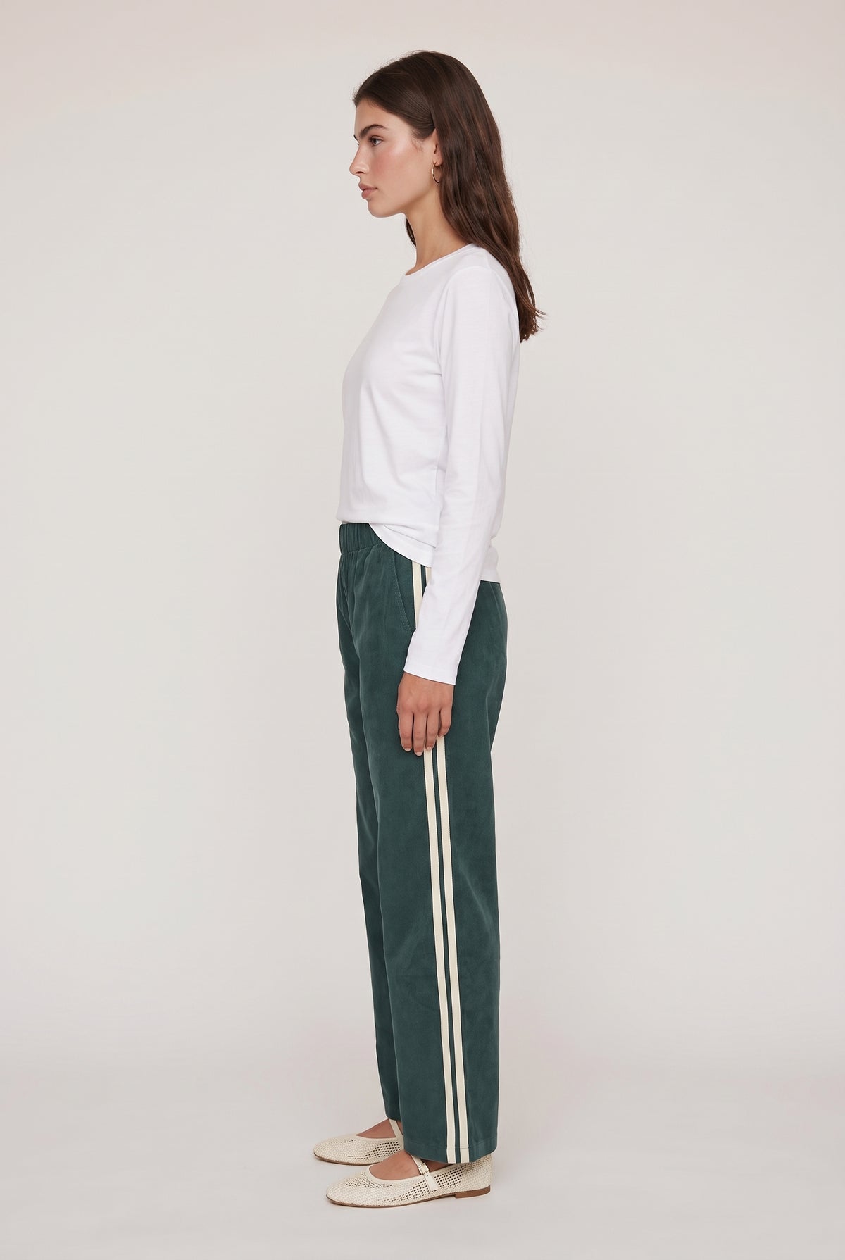 
model wearing DOWNTOWN TRACK PANT posing Side View