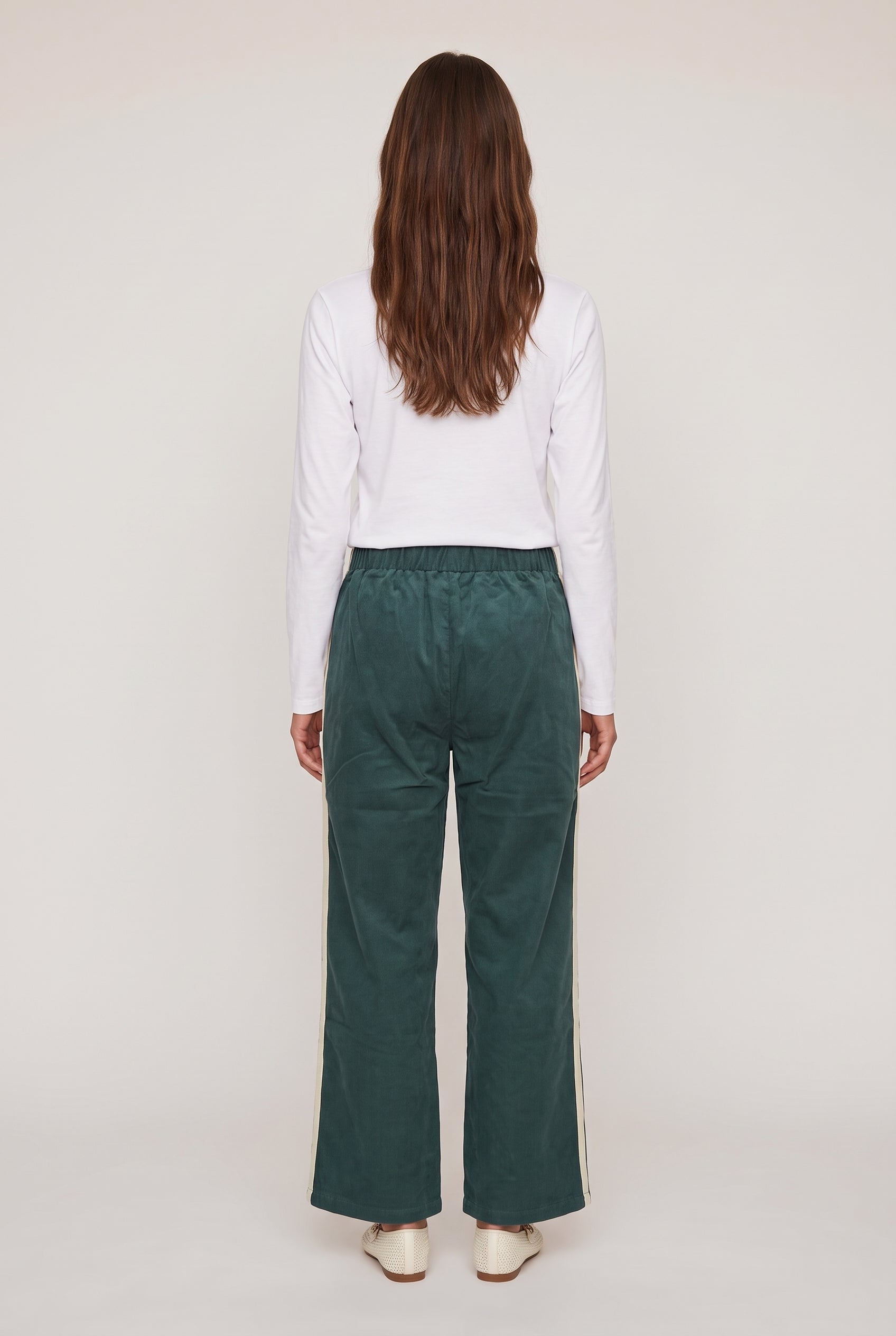 [GREEN] model wearing DOWNTOWN TRACK PANT posing Back View