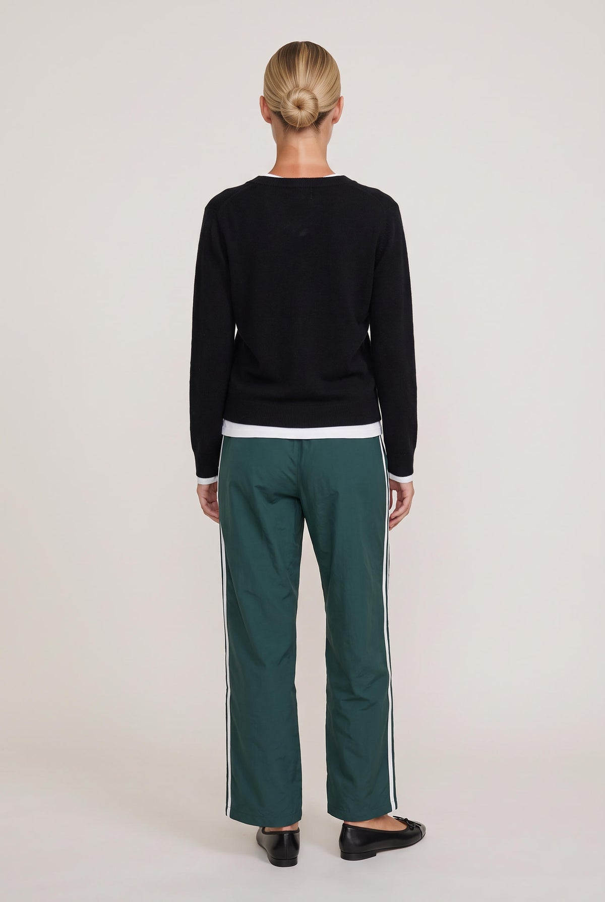 [BLACK] model wearing Mai Layered Vneck Sweater posing Front View