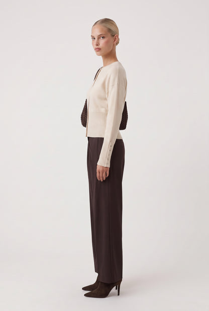
model wearing Monday Ribbed Cardigan posing Side View