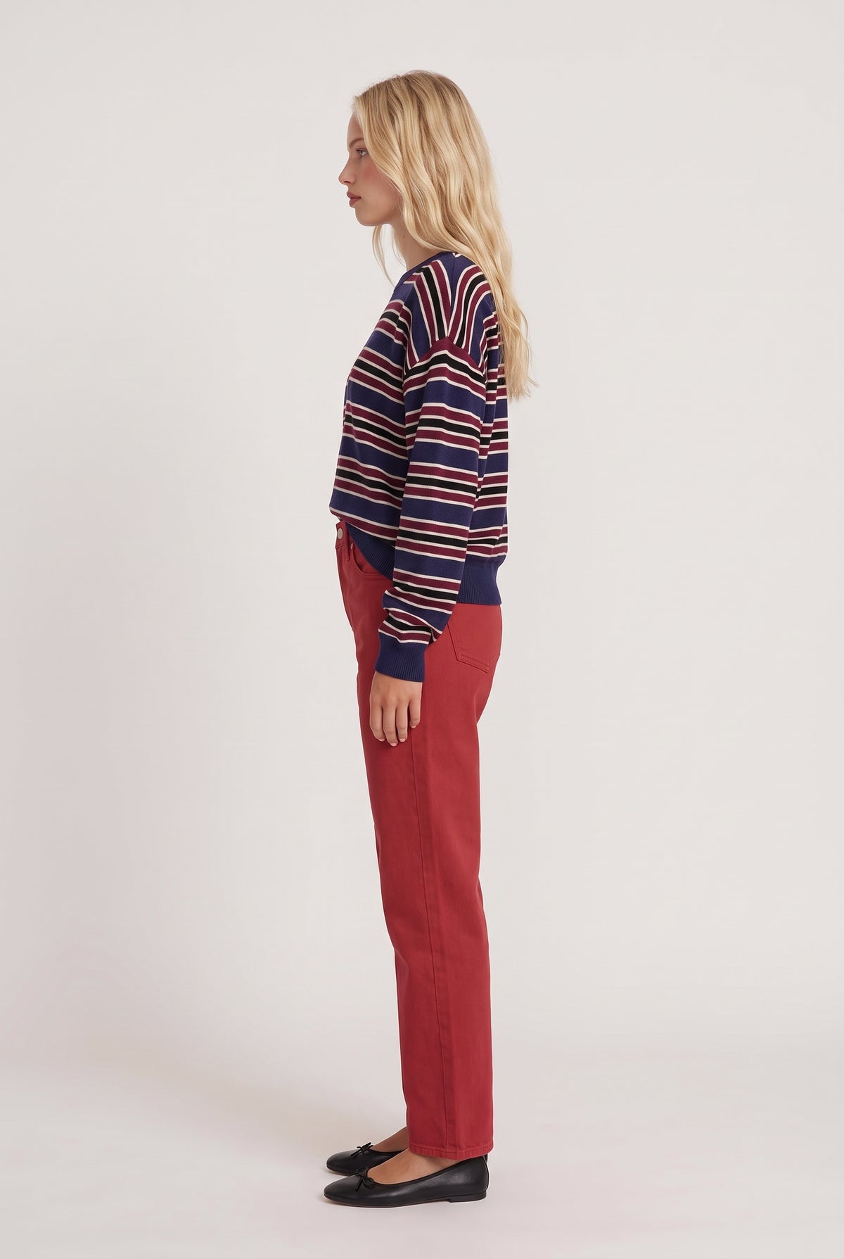 [NAVY] model wearing Rebel Striped Sweater posing Side View