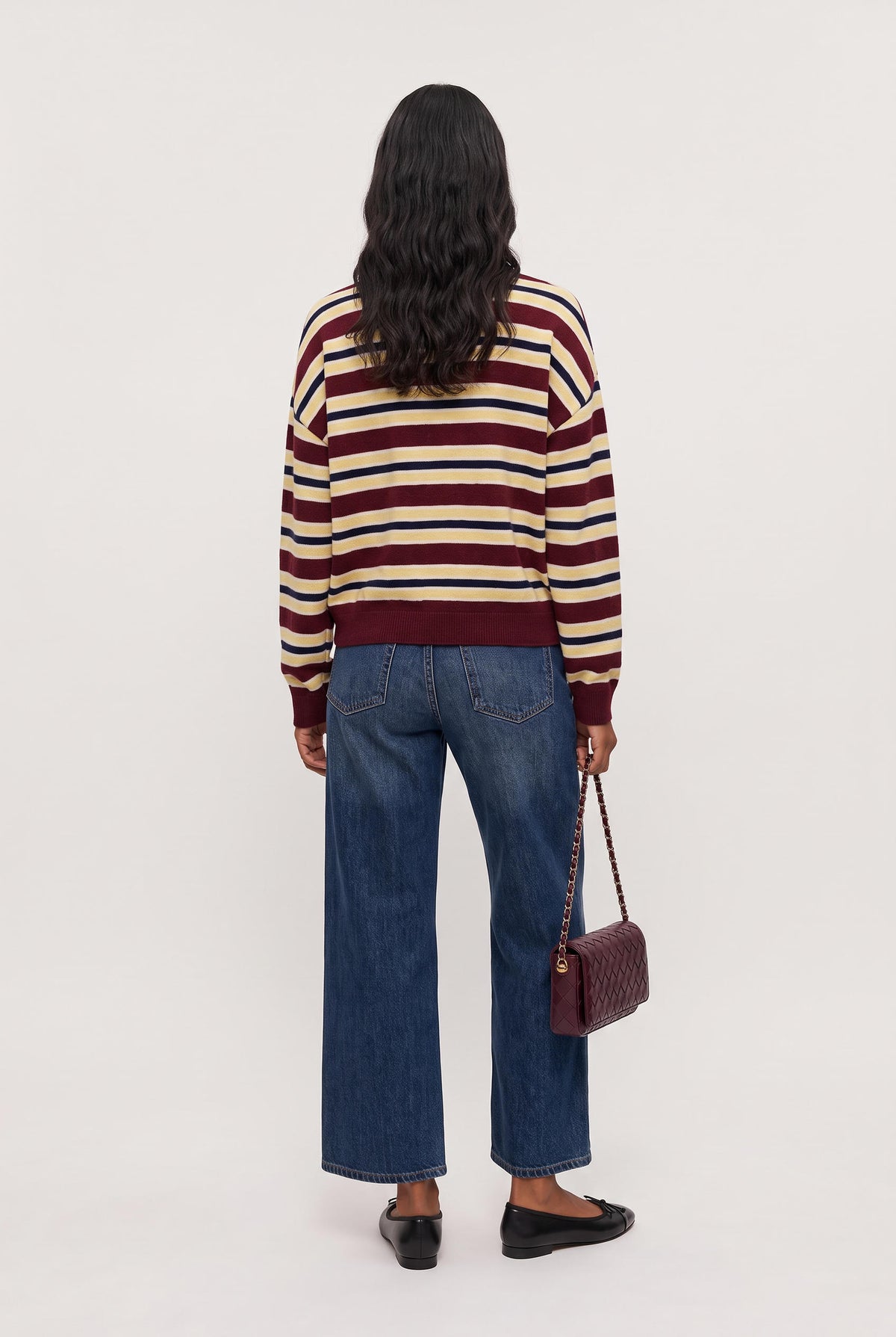 
model wearing Rebel Striped Sweater posing Front View