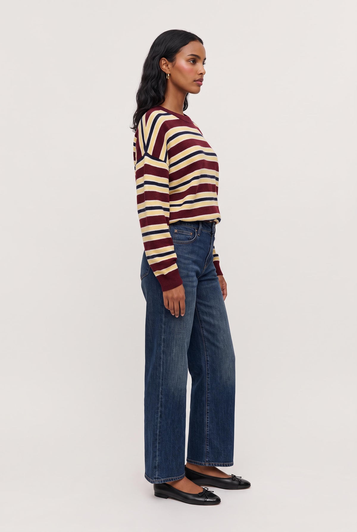 
model wearing Rebel Striped Sweater posing Front View