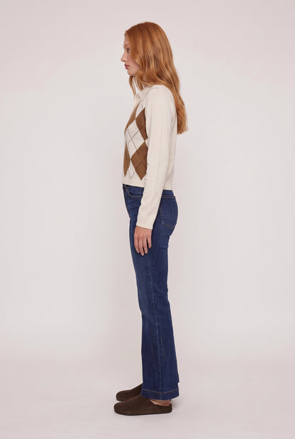 
model wearing Morris Cropped Polo posing Side View
