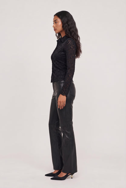 
model wearing Nina Lace Button Up Top posing Side View