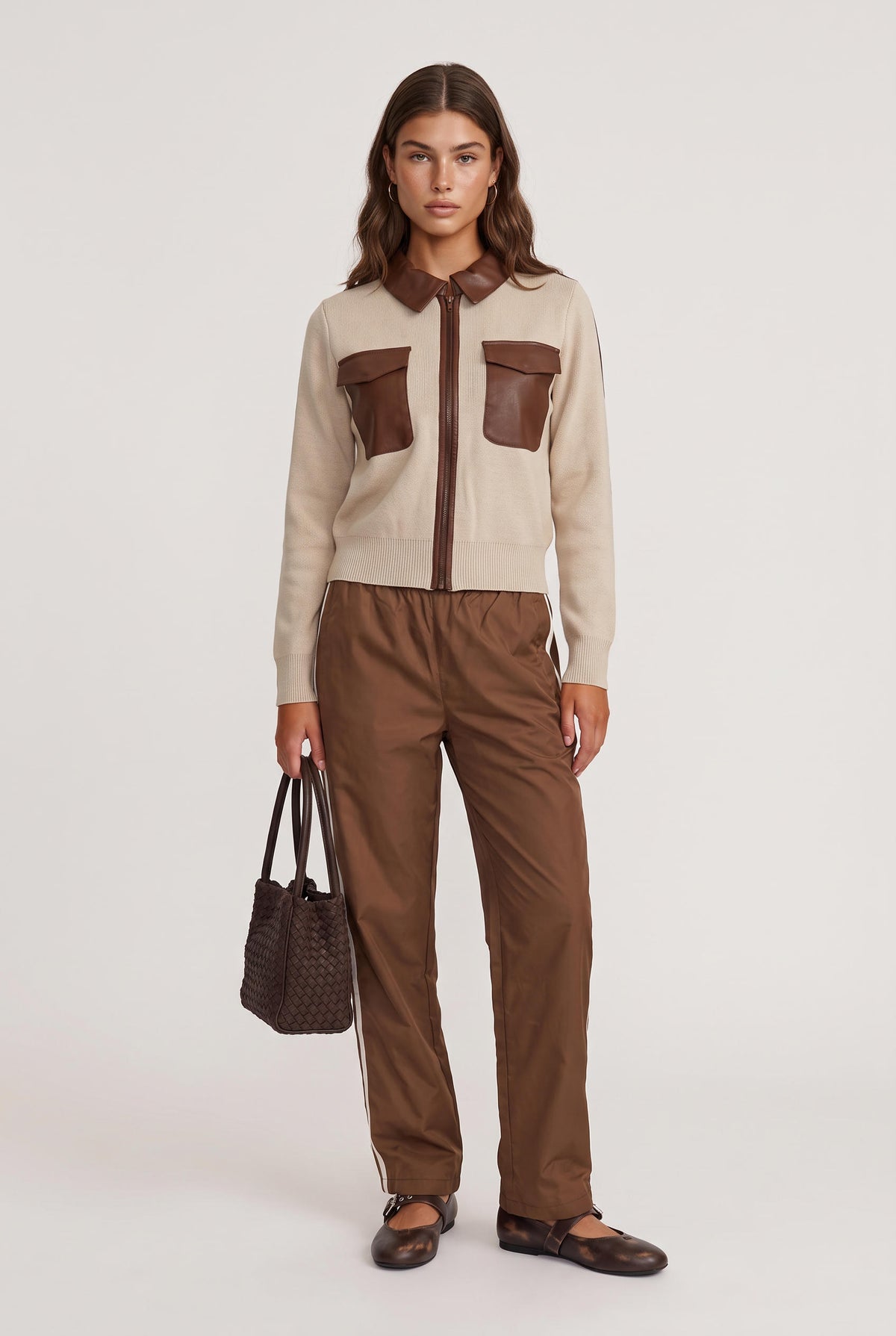 [OAT] model wearing Noa Zip Up Faux Leather Sweate posing Front View