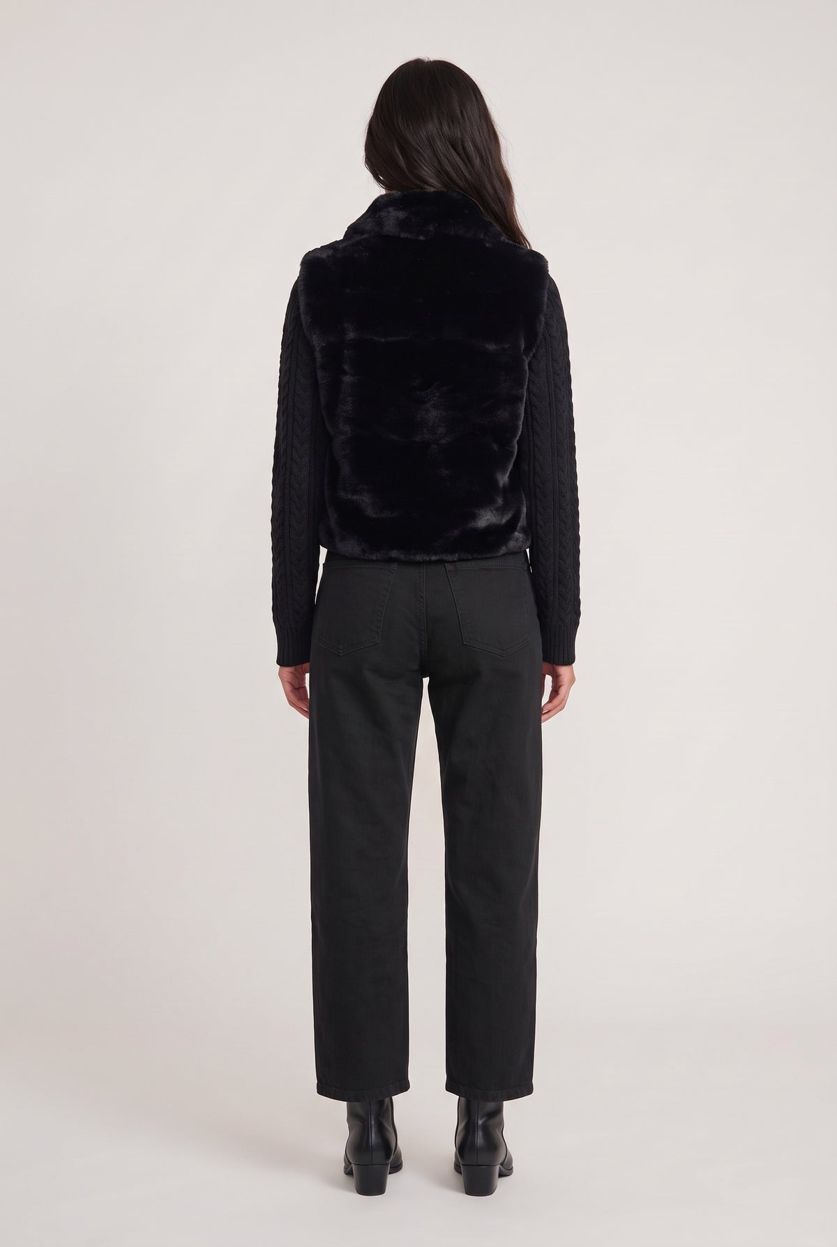 
model wearing Nova Faux Fur Jacket posing Back View
