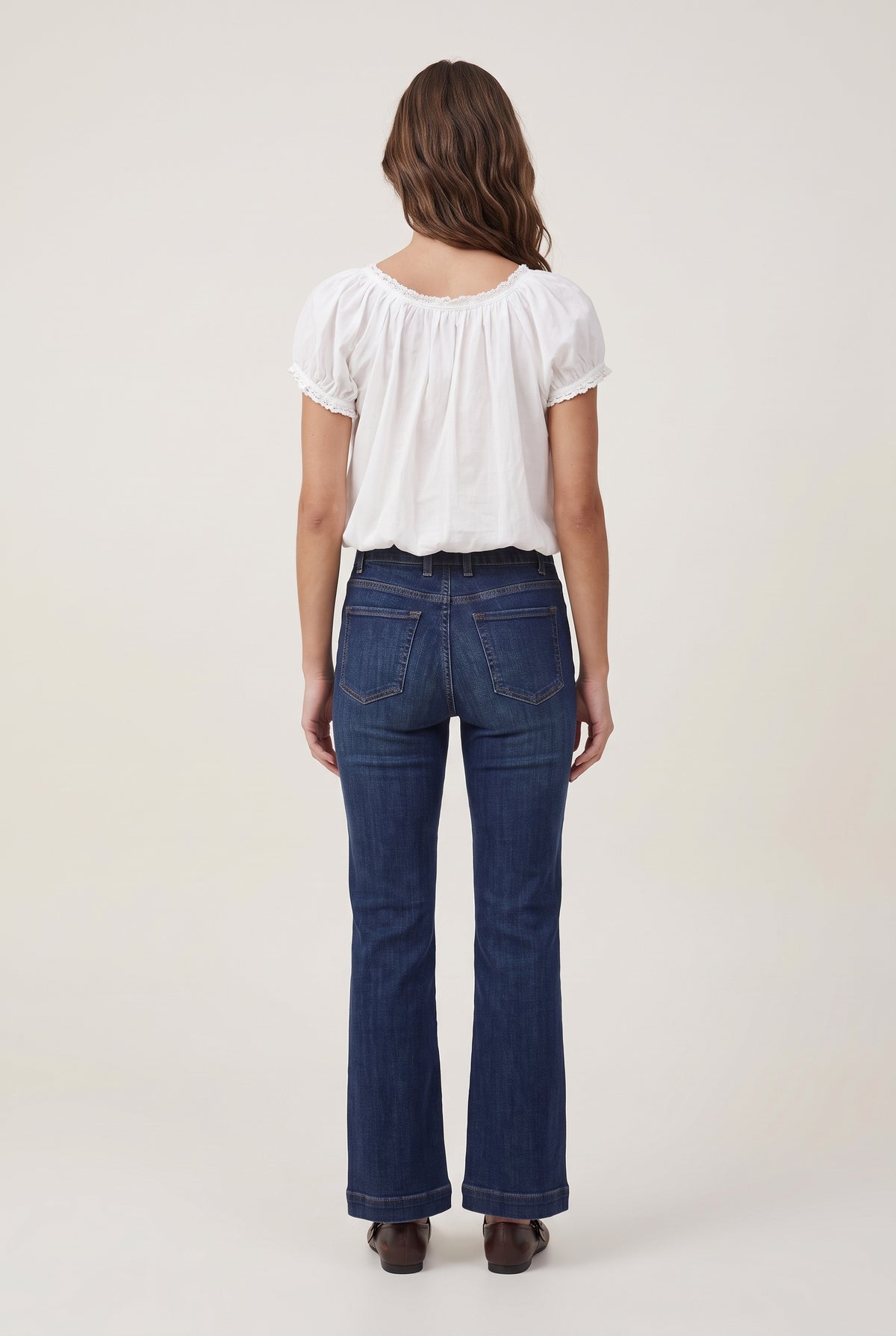 [WHITE] model wearing Gabi Lace Short Sleeve Top posing Back View