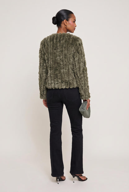 
model wearing Rosa Jacket posing back View