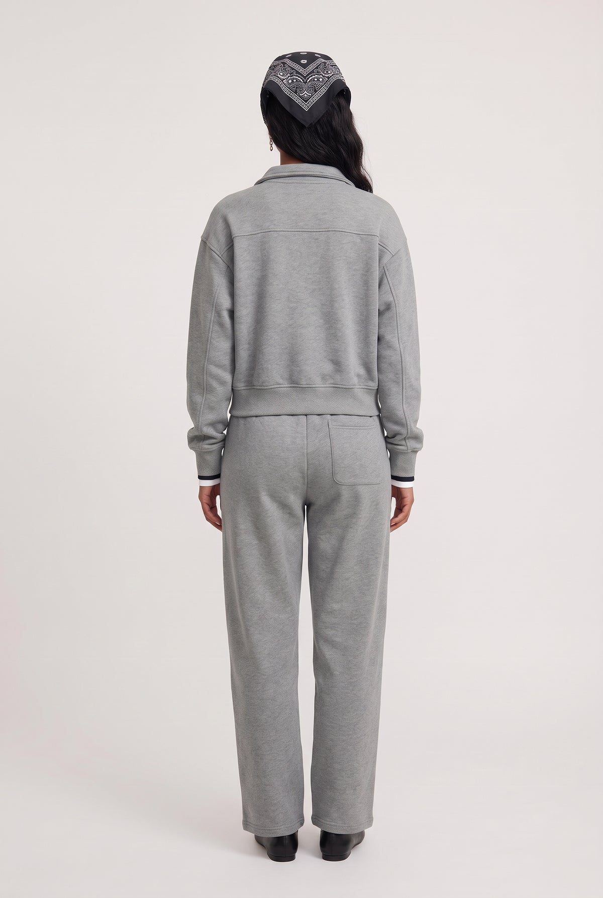 
model wearing Everyday Sweatpant posing Back View