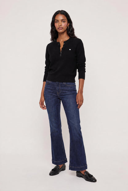 
model wearing Femme Ruffle Henley Sweater posing Front View