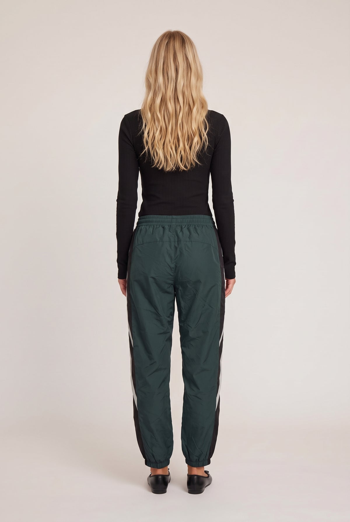 [SLATE] model wearing Aniston Pant posing Back View