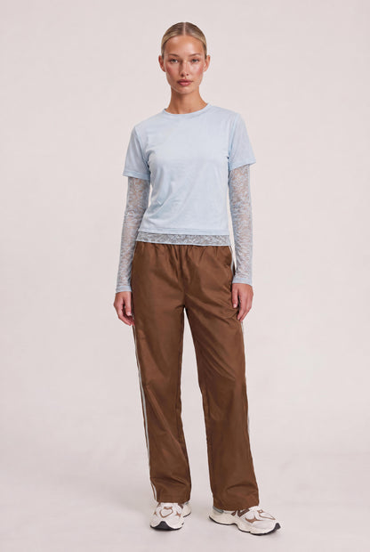 
model wearing Baby Bottega Tee posing Front View