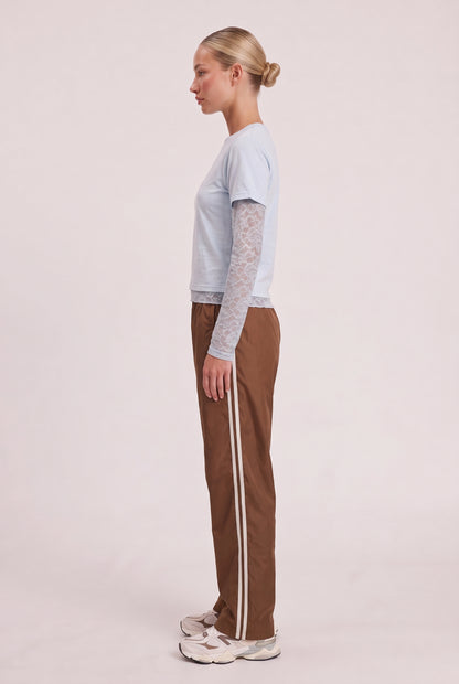 
model wearing Baby Bottega Tee posing Side View