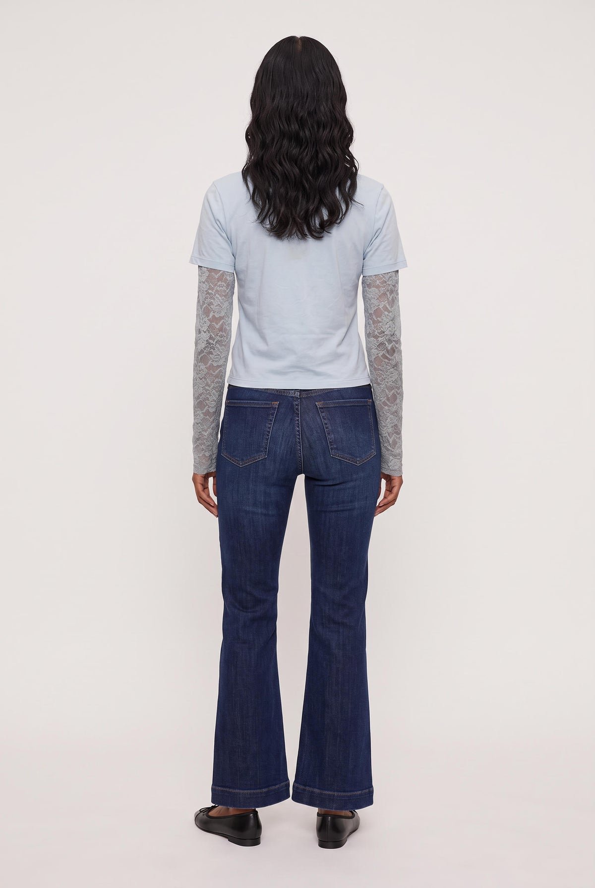 
model wearing Baby Bottega Tee posing Front View