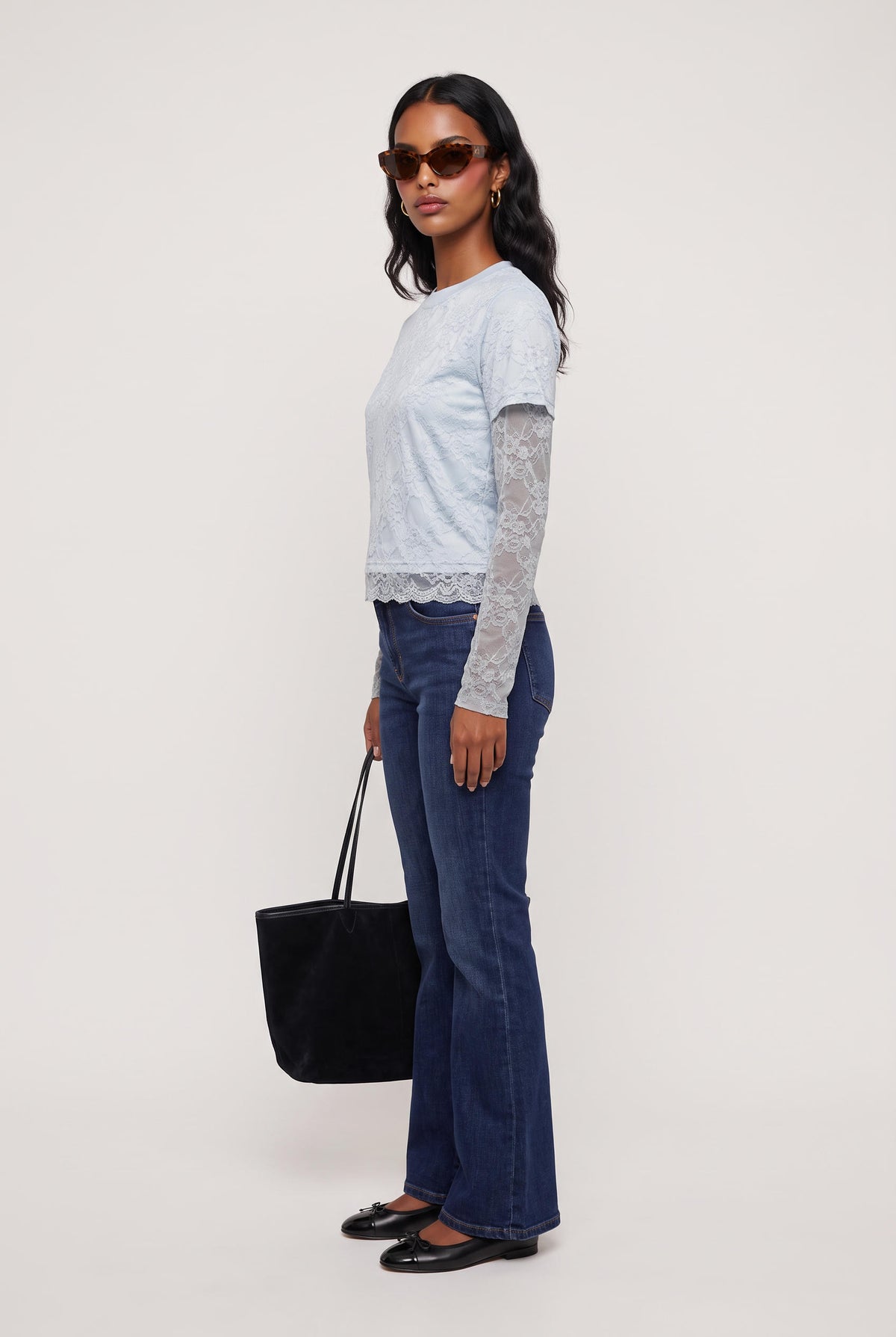 
model wearing Baby Bottega Tee posing Front View