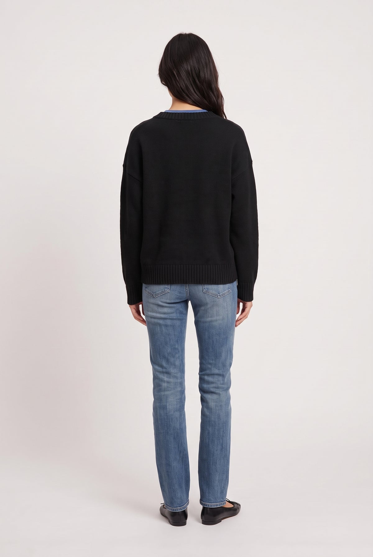 
model wearing Dolce V Knit posing Back View