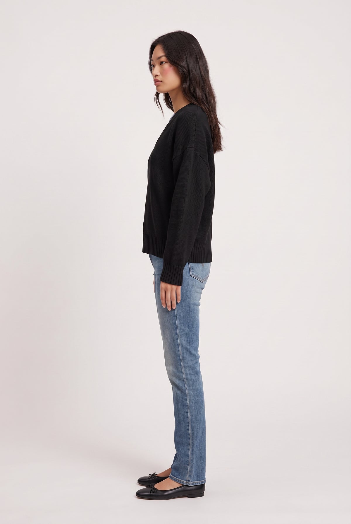
model wearing Dolce V Knit posing Side View