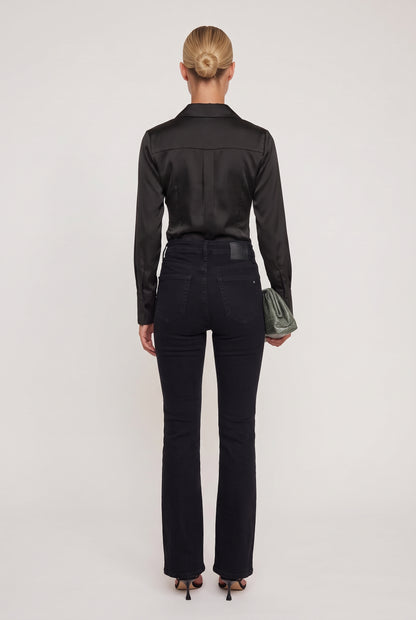 
model wearing High Rise Tummy Tuck Flare posing Back View