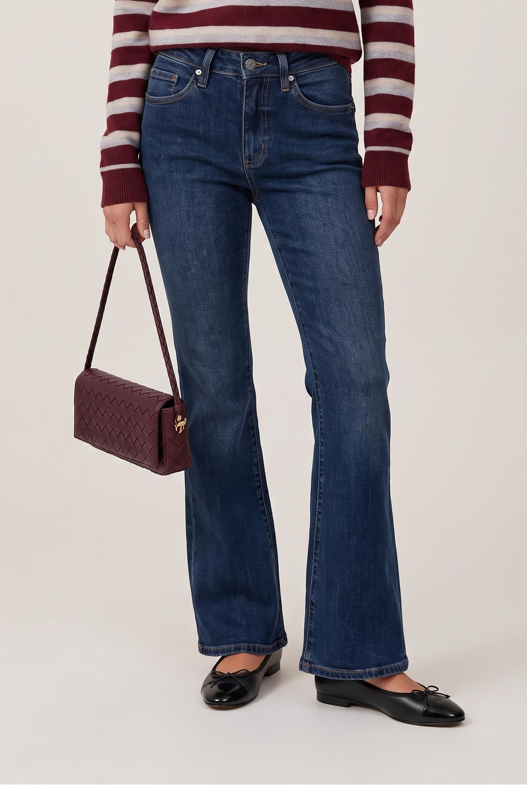 [DENIM] model wearing Mid Rise Flare Dark posing Front View