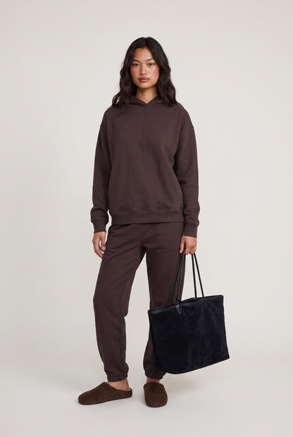 
model wearing Reversible Suede Tote posing Front View