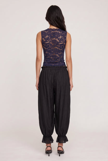 
model wearing Candace V-neck Lace Tank posing Back View