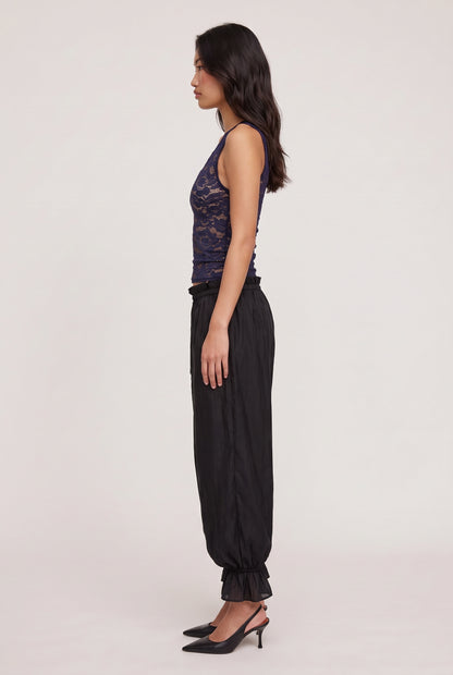 
model wearing Candace V-neck Lace Tank posing Side View