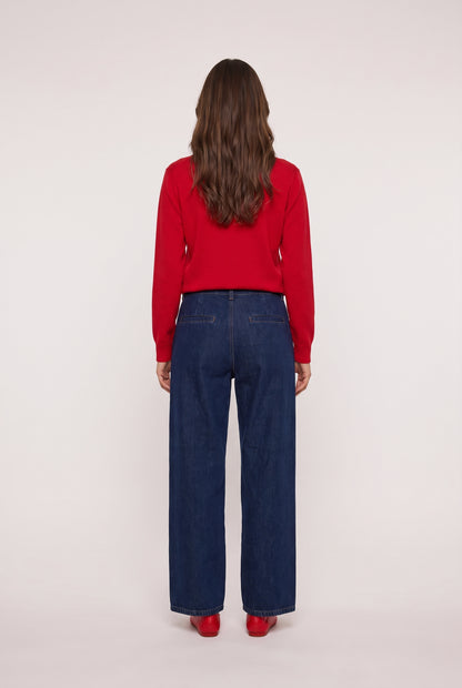 
model wearing Denim Trouser posing Back View