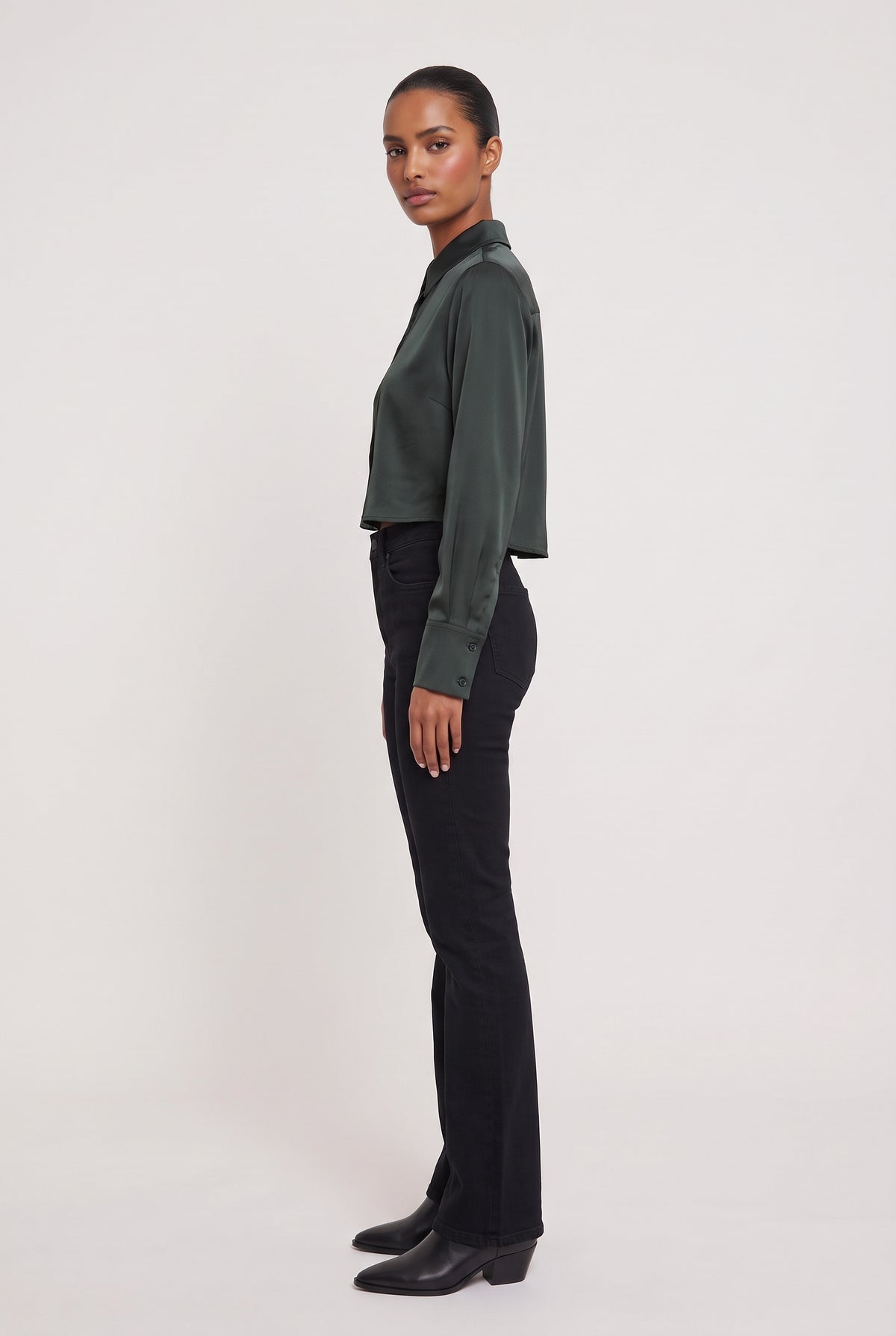 
model wearing High Low Satin Shirt posing Side View