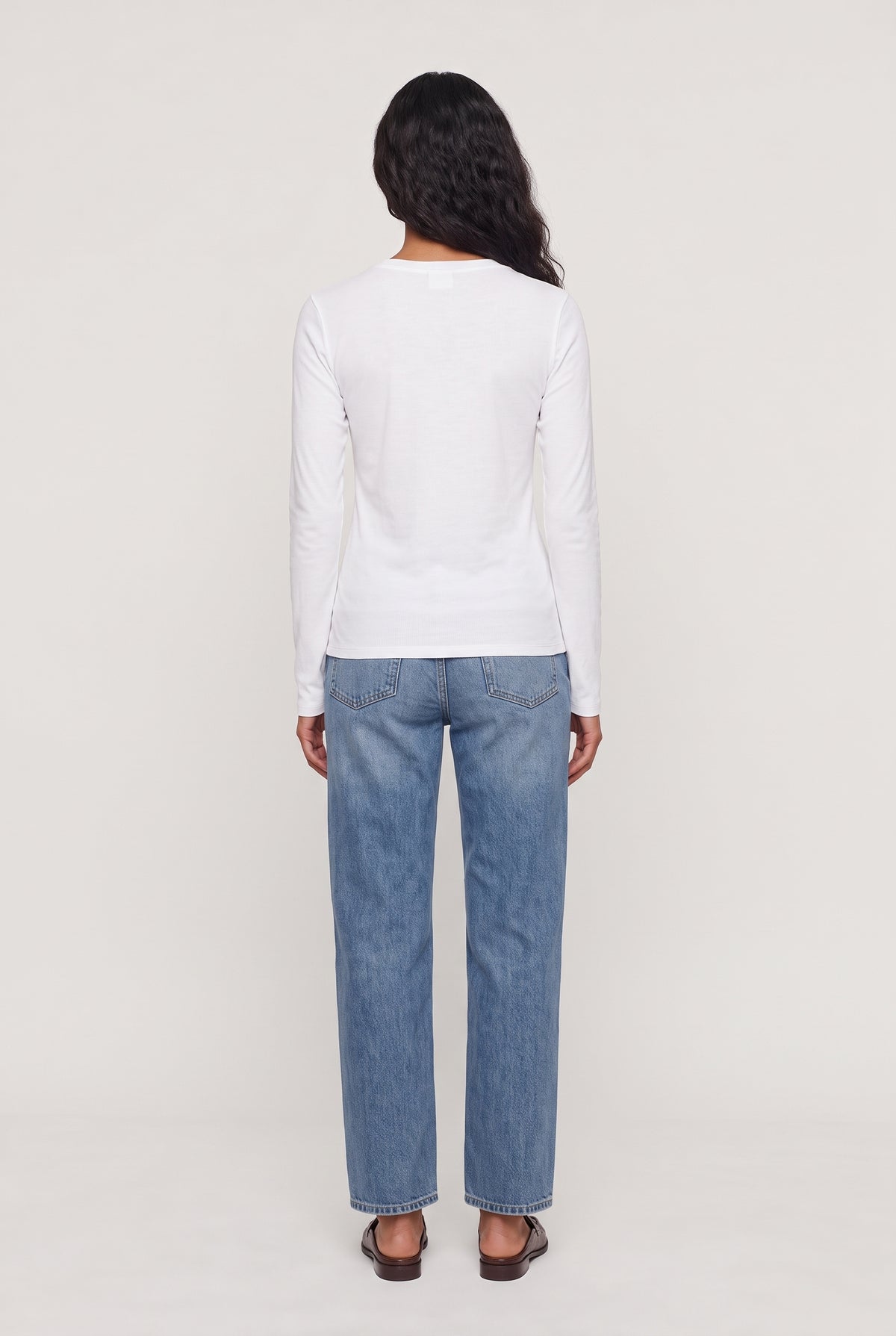 [IVORY] model wearing Long Sleeve Crewneck Shirt posing Back View