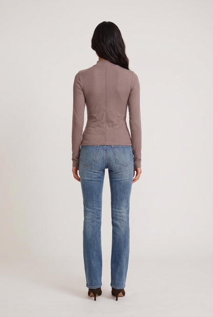 
model wearing Mock Neck Long Sleeve Knit Top posing Back View