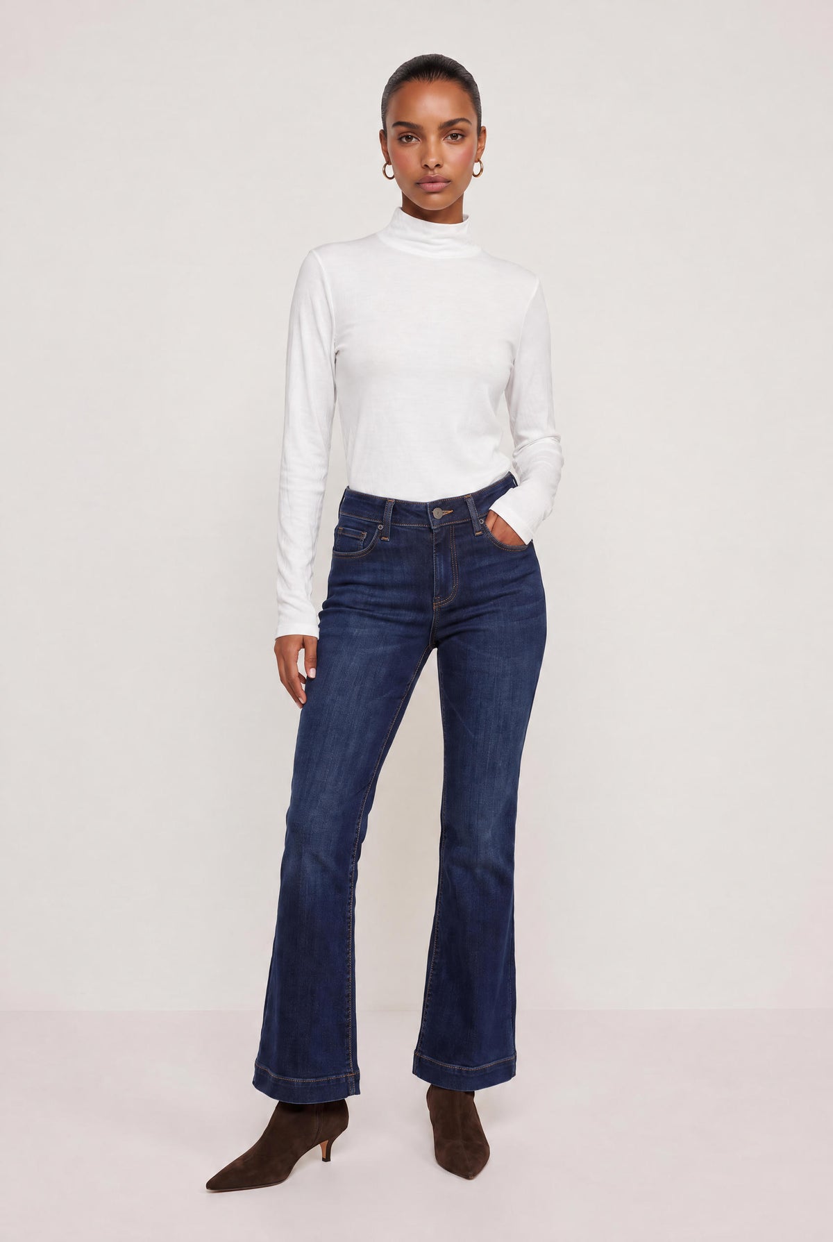 
model wearing Mock Neck Long Sleeve Knit Top posing Front View