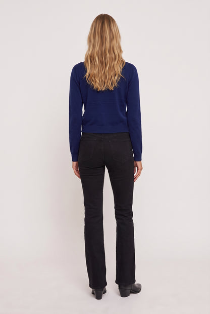 
model wearing Soho Cardigan posing Back View