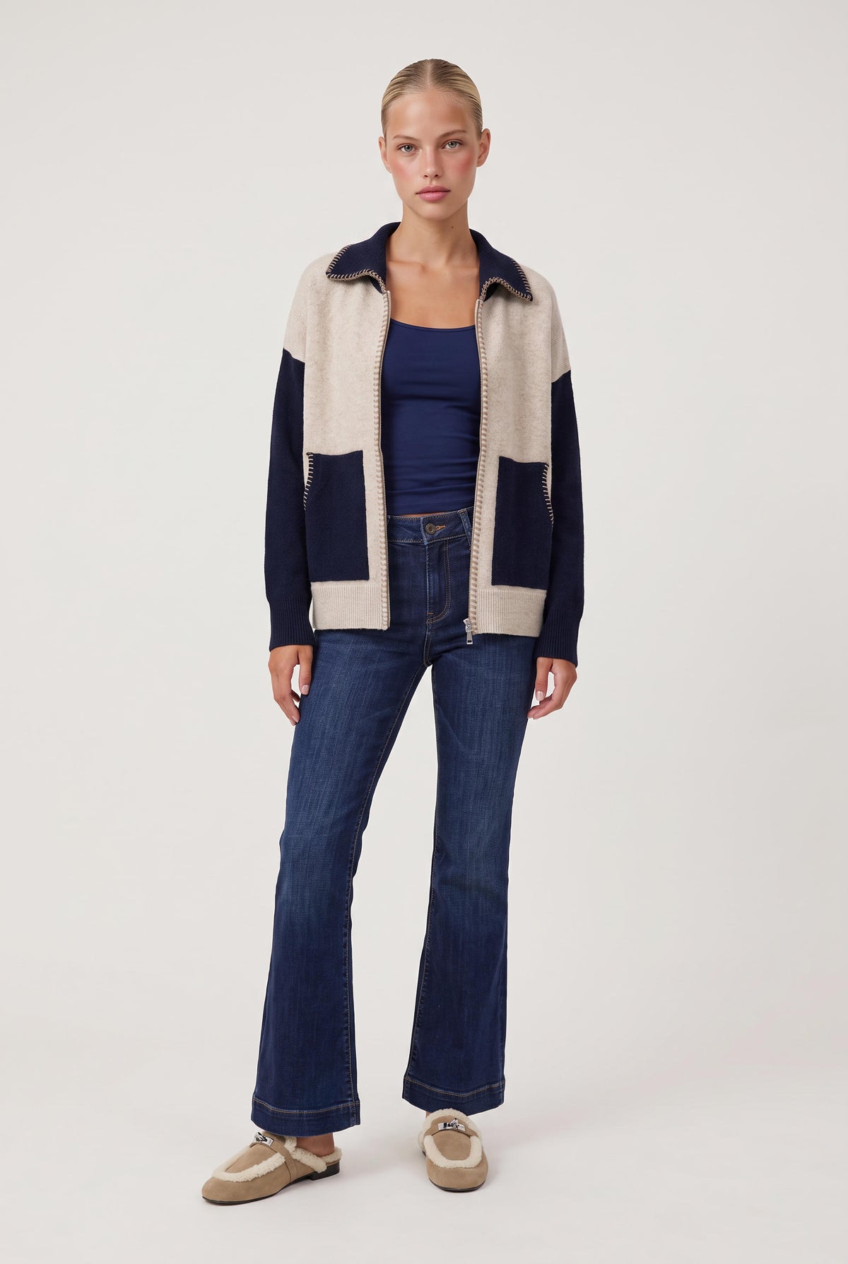 [NAVY] model wearing Stitch Perfect Zip Up Cardigan posing Front View