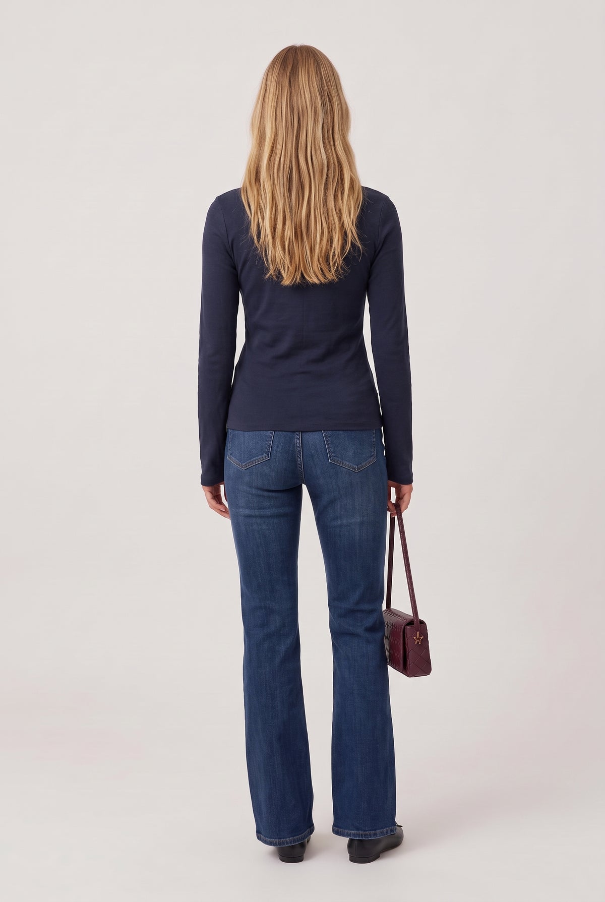 [BLACK] model wearing Turtleneck Knit Long Sleeve posing Back View