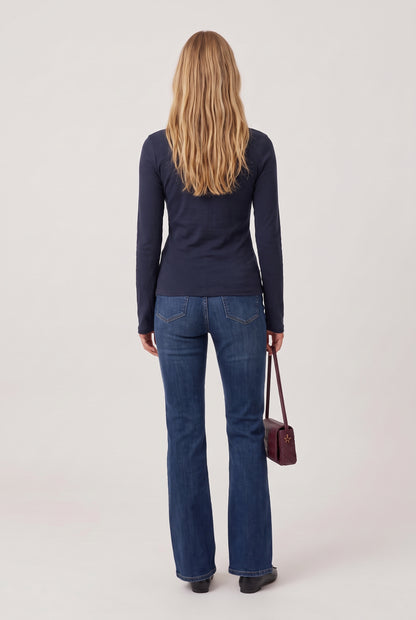 
model wearing Turtleneck Knit Long Sleeve posing Back View
