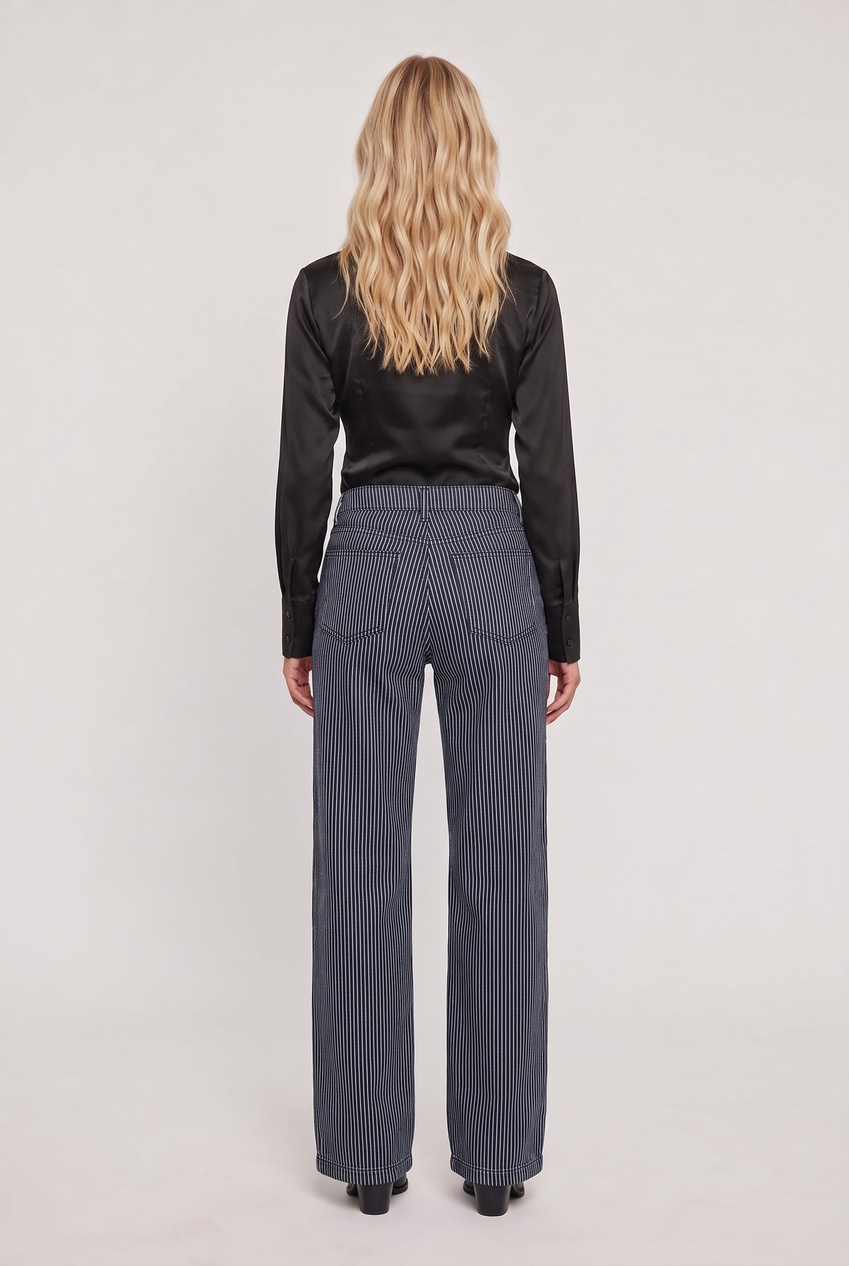 
model wearing Washed Black Striped Jean posing Back View