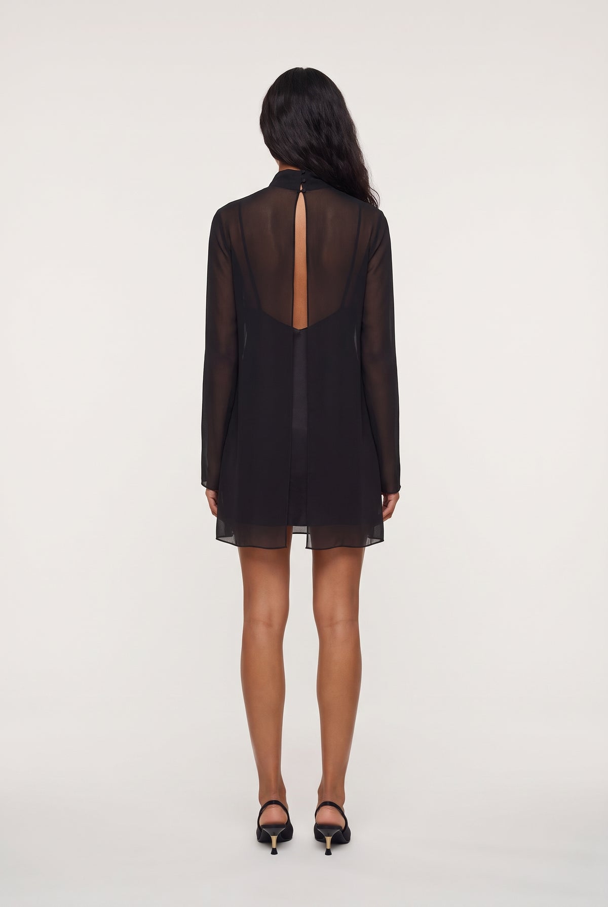 [JETBLACK] model wearing Leo Turtleneck posing Back View